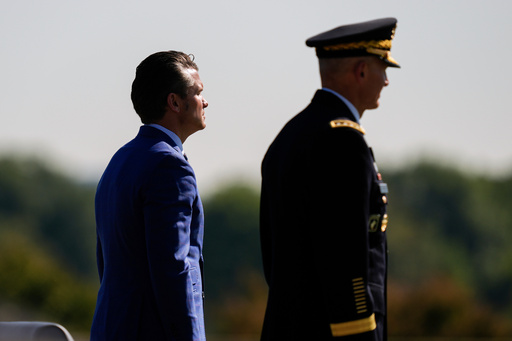 FILE - Defense Secretary Pete Hegseth, left, and Army Chief of Staff Gen. Randy George review troops during the POW/MIA National Recognition Day Ceremony at the Pentagon, Sept. 19, 2025, in Washington. (AP Photo/Julia Demaree Nikhinson, File)