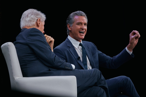 Governor of California Gavin Newsom, right, speaks next to former U.S. President Bill Clinton, left, during the Clinton Global Initiative on Wednesday, Sept. 24, 2025, in New York. (AP Photo/Andres Kudacki)