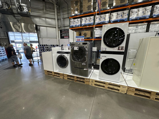 FILE - Washers stand on display near the entrance to a Costco warehouse Tuesday, July 8, 2025, in Sheridan, Colo. (AP Photo/David Zalubowski, File)