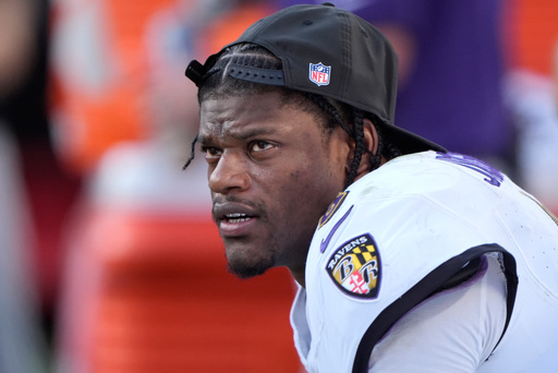Baltimore Ravens quarterback Lamar Jackson sits on the bench after being replaced by Cooper Rush during the second half of an NFL football game against the Kansas City Chiefs Sunday, Sept. 28, 2025, in Kansas City, Mo. (AP Photo/Charlie Riedel)