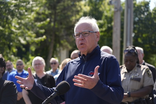 Minnesota Gov. Tim Walz speaks outside the Annunciation Catholic School following a shooting Wednesday, Aug. 27, 2025, in Minneapolis. (AP Photo/Bruce Kluckhohn)