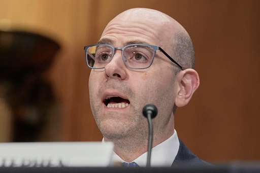 Stephen Miran testifies during a Senate Banking Committee hearing on his nomination to be a member of the Board of Governors of the Federal Reserve System, on Capitol Hill Thursday, Sept. 4, 2025, in Washington. (AP Photo/Mariam Zuhaib)