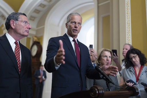 FILE - Senate Majority Leader John Thune, R-S.D., joined at left by Sen. John Barrasso, R-Wyo., the GOP whip, speaks to reporters following closed-door strategy meetings, at the Capitol in Washington, July 22, 2025. (AP Photo/J. Scott Applewhite, File)
