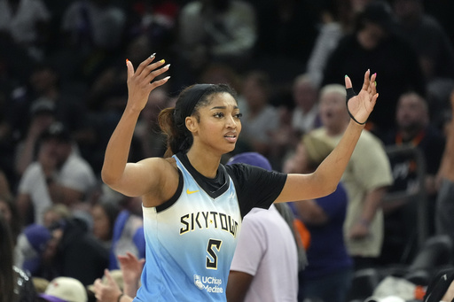 Chicago Sky forward Angel Reese walks to the bench during the second half of a WNBA basketball game against the Phoenix Mercury Thursday, Aug. 28, 2025, in Phoenix. (AP Photo/Ross D. Franklin)