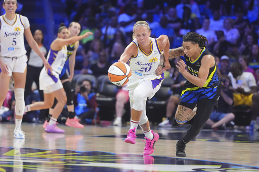 Los Angeles Sparks guard Julie Allemand (20) steals the ball against Dallas Wings guard JJ Quinerly (11) during the second half of a WNBA basketball game in Arlington, Texas, Friday, Aug. 15, 2025. (AP Photo/LM Otero)