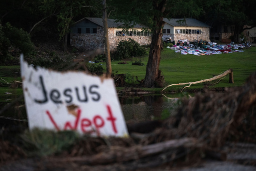 FILE - Campers belongings sit outside one of Camp Mystic's cabins near the Guadalupe River, July 7, 2025, in Hunt, Texas, after a flash flood swept through the area. (AP Photo/Eli Hartman, File)