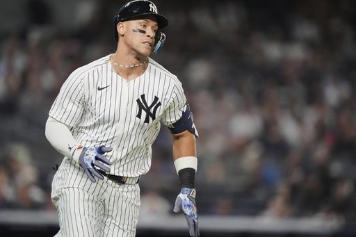 New York Yankees' Aaron Judge runs to first base for a single during the sixth inning of a baseball game against the Detroit Tigers Thursday, Sept. 11, 2025, in New York. (AP Photo/Frank Franklin II)
