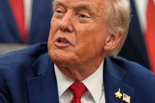 President Donald Trump speaks in the Oval Office of the White House before signing an executive order regarding childhood cancer and the use of AI, Tuesday, Sept. 30, 2025, in Washington. (AP Photo/Alex Brandon)