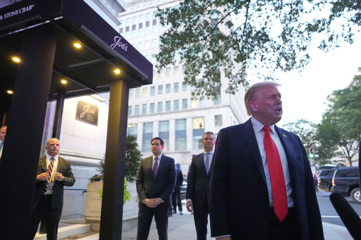 President Donald Trump speaks to reporters before he enters a restaurant near the White House, Tuesday, Sept. 9, 2025, in Washington, to have dinner with Secretary of State Marco Rubio, Defense Secretary Pete Hegseth and Vice President JD Vance. (AP Photo/Alex Brandon)