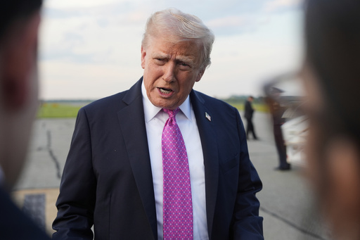 President Donald Trump speaks with reporters before boarding Air Force One at Morristown Airport, Sunday, Sept. 14, 2025, in Morristown, N.J. (AP Photo/Alex Brandon)