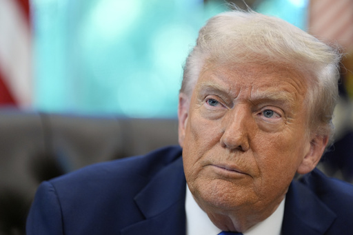 President Donald Trump listens to a reporter's question in the Oval Office of the White House, Friday, Sept. 19, 2025, in Washington. (AP Photo/Alex Brandon)
