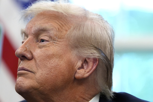 President Donald Trump listens in the Oval Office of the White House, Monday, Sept. 15, 2025, in Washington. (AP Photo/Alex Brandon)