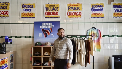Fabio Fernandez arranges clothes for his residency at Definitive Selection clothing store, one of many businesses in the predominantly Latino neighborhood that has seen a slowdown in foot traffic since President Donald Trump's threats of a federal law enforcement intervention, on Friday, Sept. 5, 2025 in Chicago. (AP Photo/Mark Vancleave)