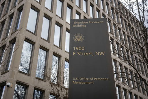 FILE - The Theodore Roosevelt Building, location of the U.S. Office of Personnel Management, is pictured, Feb. 13, 2024, in Washington. (AP Photo/Mark Schiefelbein, File)