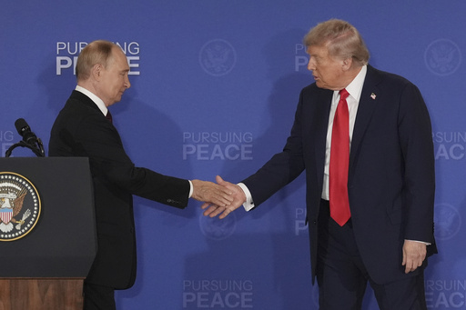 President Donald Trump, right, shakes the hand of Russia's President Vladimir Putin during a joint press conference at Joint Base Elmendorf-Richardson, Alaska, Friday, Aug. 15, 2025. (AP Photo/Jae C. Hong)