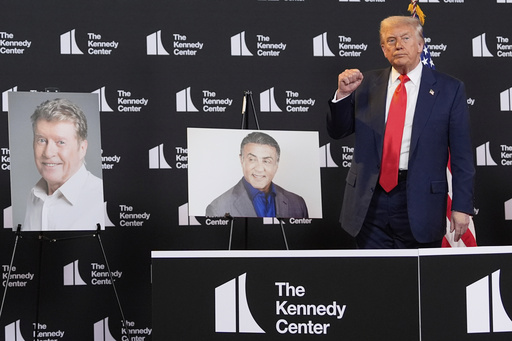 FILE - President Donald Trump stands beside photos of Kennedy Center Honors nominees at the Kennedy Center, Aug. 13, 2025, in Washington. (AP Photo/Alex Brandon, File)