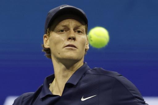 Jannik Sinner, of Italy, returns a shot to Lorenzo Musetti, of Italy, during the quarterfinal round of the U.S. Open tennis championships, Wednesday, Sept. 3, 2025, in New York. (AP Photo/Adam Hunger)
