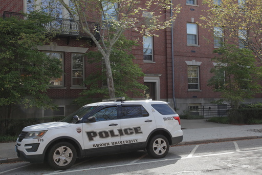 A Brown University police vehicle parks near campus, in Providence, R.I., Monday, Sept. 29, 2025. (AP Photo/Kimberlee Kruesi)
