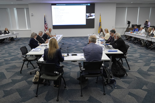 Committee members attend a meeting of the Advisory Committee on Immunization Practices at the CDC on Thursday, Sept. 18, 2025, in Chamblee, Ga. (AP Photo/Brynn Anderson)