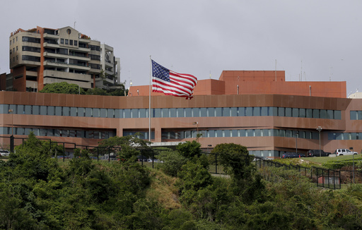 FILE - The U.S flag flies outside the U.S. embassy in Caracas, Venezuela, Jan. 24, 2019. (AP Photo/Fernando Llano, File)