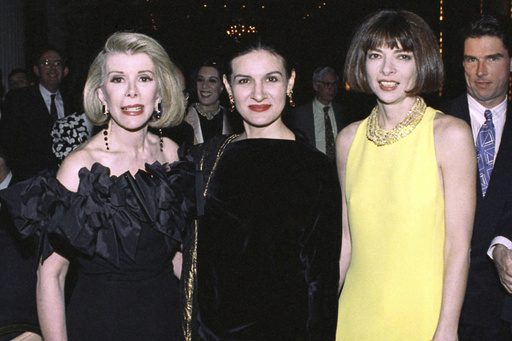 FILE - Joan Rivers, Paloma Picasso and Vogue editor Anna Wintour attend a benefit dinner for the American Suicide Foundation at the Waldorf Astoria in New York on May 3, 1991. (AP Photo/Luiz Ribeiro, File)