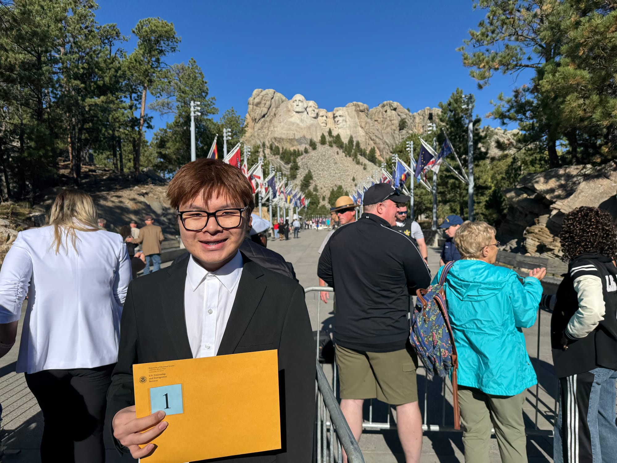 Amid illegal immigration purge, new citizens are welcomed