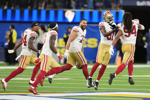 San Francisco 49ers players celebrate after defeating the Los Angeles Rams in overtime of an NFL football game, Thursday, Oct. 2, 2025, in Inglewood, Calif. (AP Photo/Marcio Jose Sanchez)