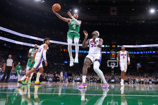 Boston Celtics guard Anfernee Simons (4) drives to the basket against the Philadelphia 76ers during the first half of an NBA basketball game, Wednesday, Oct. 22, 2025, in Boston. (AP Photo/Charles Krupa)