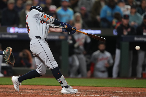 Detroit Tigers' Zach McKinstry hits a single to score Spencer Torkelson for the go-ahead run during the 11th inning in Game 1 of baseball's American League Division Series against the Seattle Mariners, Saturday, Oct. 4, 2025, in Seattle. (AP Photo/Lindsey Wasson)