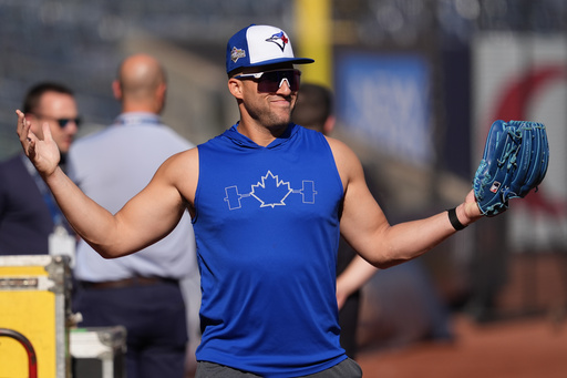 Toronto Blue Jays' George Springer walks on the field during batting practice at Yankee Stadium in New York, Monday, Oct. 6, 2025. (AP Photo/Seth Wenig)