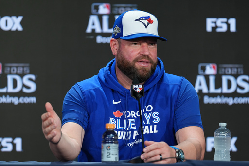 Toronto Blue Jays manager John Schneider talks to reporters at Yankee Stadium in New York, Monday, Oct. 6, 2025. (AP Photo/Seth Wenig)