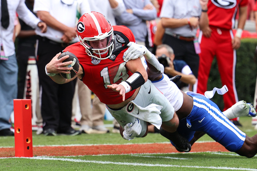 Georgia quarterback Gunner Stockton (14) dives in for a touchdown during the first half of an NCAA college football game against Kentucky, Saturday, Oct. 4, 2025, in Athens, Ga. (AP Photo/Colin Hubbard)