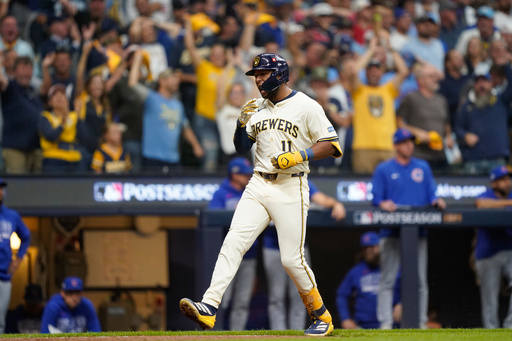 Milwaukee Brewers' Jackson Chourio (11) celebrates while running the bases after hitting a 3-run home run during the fourth inning of Game 2 of baseball's National League Division Series against the Chicago Cubs Monday, Oct. 6, 2025, in Milwaukee. (AP Photo/Kayla Wolf)