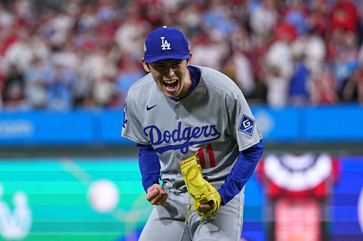 Los Angeles Dodgers pitcher Roki Sasaki reacts after the Dodgers defeated the Philadelphia Phillies in Game 1 of baseball's National League Division Series, Saturday, Oct. 4, 2025, in Philadelphia. (AP Photo/Matt Rourke)