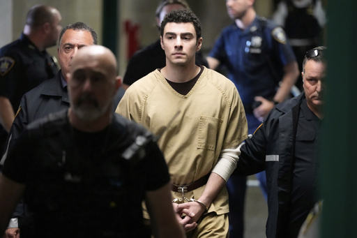 Luigi Mangione is escorted into Manhattan state court in New York, Tuesday, Sept. 16, 2025. (AP Photo/Seth Wenig)