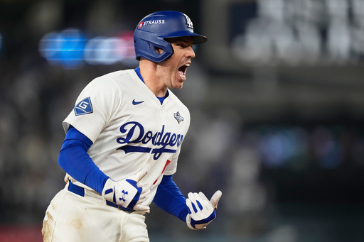Los Angeles Dodgers' Freddie Freeman celebrates his walk off home run against the Toronto Blue Jays during the 18th inning in Game 3 of baseball's World Series, Monday, Oct. 27, 2025, in Los Angeles. (AP Photo/Brynn Anderson)