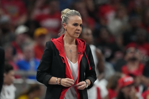 Las Vegas Aces head coach Becky Hammon watches during first half of Game 3 of a WNBA basketball playoff semifinals series against the Indiana Fever, Friday, Sept. 26, 2025, in Indianapolis. (AP Photo/Darron Cummings)