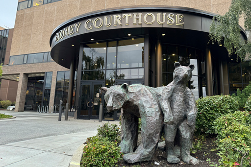 FILE - Bear sculptures sit outside the Boney Courthouse, where the Alaska Supreme Court hears cases, in downtown Anchorage, Alaska, Sept. 10, 2024. (AP Photo/Mark Thiessen, File)