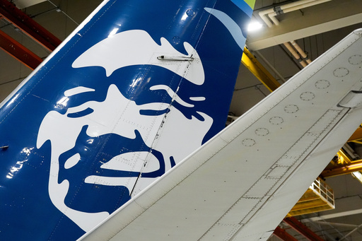 FILE - An Alaska Airlines aircraft sits in the airline's hangar at Seattle-Tacoma International Airport, Jan. 10, 2024, in SeaTac, Wash. (AP Photo/Lindsey Wasson, File)