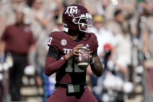 Texas A&M quarterback Marcel Reed (10) looks to pass down field against Auburn during the first half of an NCAA college football game Saturday, Sept. 27, 2025, in College Station, Texas. (AP Photo/Sam Craft)