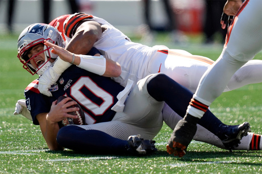 New England Patriots quarterback Drake Maye (10) is sacked by Cleveland Browns defensive end Myles Garrett in the first half of an NFL football game on Sunday, Oct. 26, 2025, in Foxborough, Mass. (AP Photo/Charles Krupa)