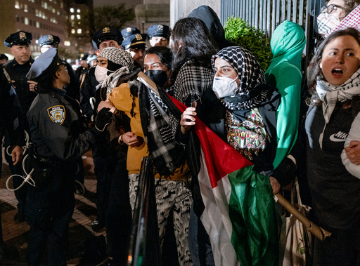 FILE - Leqaa Kordia, second from right, demonstrates with pro-Palestianian protesters as they gather near a main gate at Columbia University in New York, Tuesday, April 30, 2024, just before New York City police officers cleared the area after a building was taken over by protesters earlier in the day. (AP Photo/Craig Ruttle, File)