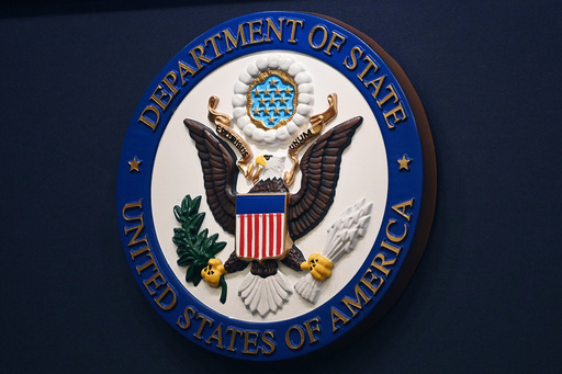 FILE - The State Department seal is seen on the briefing room lectern at the State Department in Washington, Jan. 31, 2022. (Mandel Ngan, Pool via AP, File)