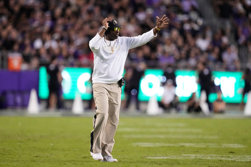 Colorado head coach Deion Sanders calls for a time out in the first half of an NCAA college football game against TCU Saturday, Oct. 4, 2025, in Fort Worth, Texas. (AP Photo/Tony Gutierrez)