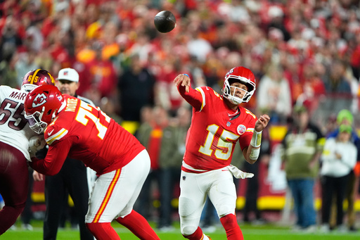 Kansas City Chiefs quarterback Patrick Mahomes (15) throws during the first half of an NFL football game against the Washington Commanders Monday, Oct. 27, 2025, in Kansas City, Mo. (AP Photo/Charlie Riedel)