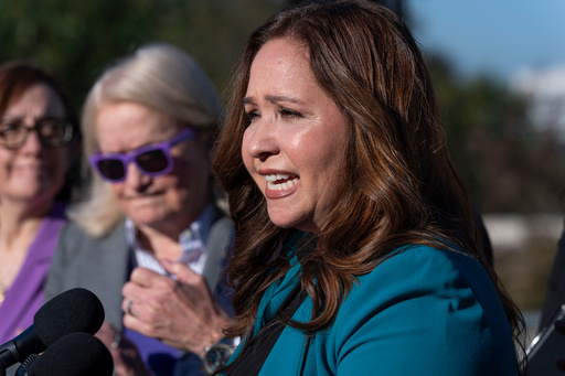 Rep.-elect Adelita Grijalva, D-Ariz., speaks as she is surrounded by supporters who have urged that House Speaker Mike Johnson swear her in, at the Capitol in Washington, Wednesday, Oct. 15, 2025. (AP Photo/J. Scott Applewhite)