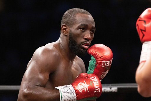 FILE - Terence "Bud" Crawford, left, fights David Avanesyan during a WBO welterweight title boxing bout on Saturday, Dec. 10, 2022, in Omaha, Neb. AP Photo/Rebecca S. Gratz, File)