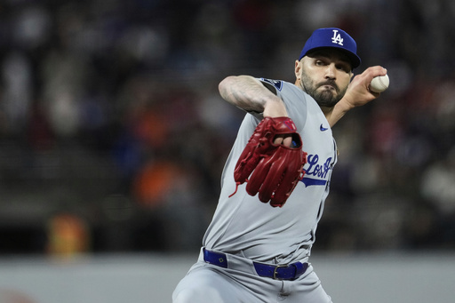 Los Angeles Dodgers pitcher Tanner Scott throws to a San Francisco Giants batter during the ninth inning of a baseball game Saturday, Sept. 13, 2025, in San Francisco. (AP Photo/Godofredo A. Vásquez)