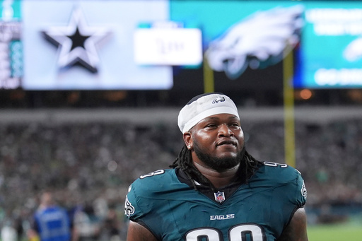 FILE - Philadelphia Eagles' Jalen Carter walks off the field after being ejected from an NFL football game against the Dallas Cowboys, Thursday, Sept. 4, 2025, in Philadelphia. (AP Photo/Matt Slocum, File)