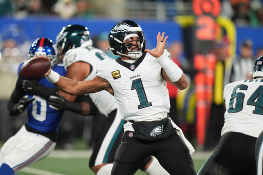 Philadelphia Eagles' Jalen Hurts plays during the first half of an NFL football game against the New York Giants Thursday, Oct. 9, 2025, in East Rutherford, N.J. (AP Photo/Seth Wenig)